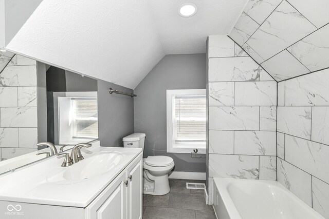 1653 S Delaware St, Indianapolis, IN 46225 - full bath featuring toilet, vanity, lofted ceiling, and plenty of natural light