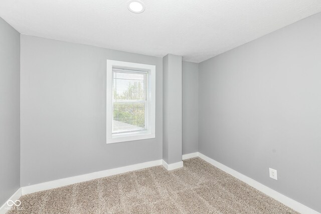 1653 S Delaware St, Indianapolis, IN 46225 - empty room featuring carpet flooring and baseboards