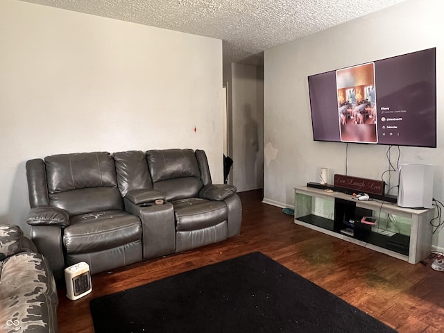 2194 N Riley Ave, Indianapolis, IN 46218 - living room featuring baseboards, wood finished floors, and a textured ceiling