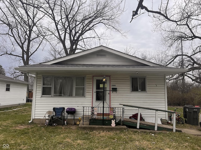 2194 N Riley Ave, Indianapolis, IN 46218 - bungalow-style home featuring a front yard