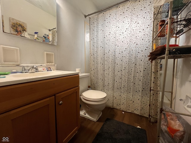 2194 N Riley Ave, Indianapolis, IN 46218 - full bath with toilet, vanity, a shower with shower curtain, and wood finished floors