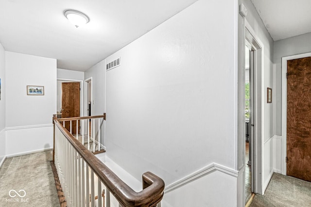7138 Avalon Trail Ct, Indianapolis, IN 46250 - hall with carpet flooring and an upstairs landing