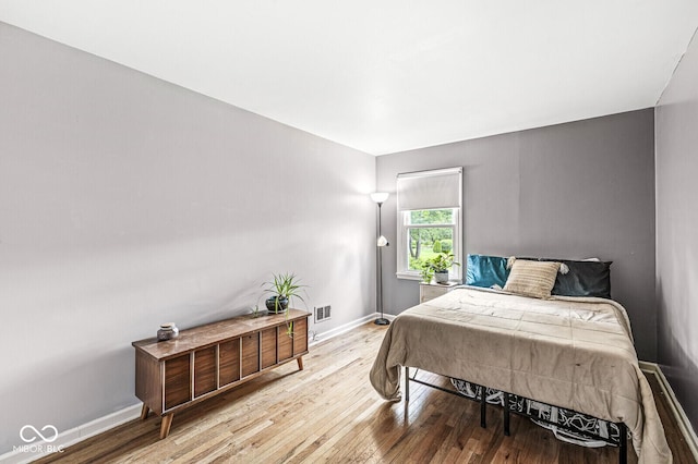 7138 Avalon Trail Ct, Indianapolis, IN 46250 - bedroom featuring wood-type flooring and baseboards