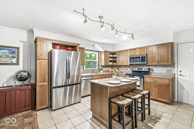 7138 Avalon Trail Ct, Indianapolis, IN 46250 - kitchen featuring stainless steel appliances, light tile patterned flooring, light countertops, decorative backsplash, and a kitchen island