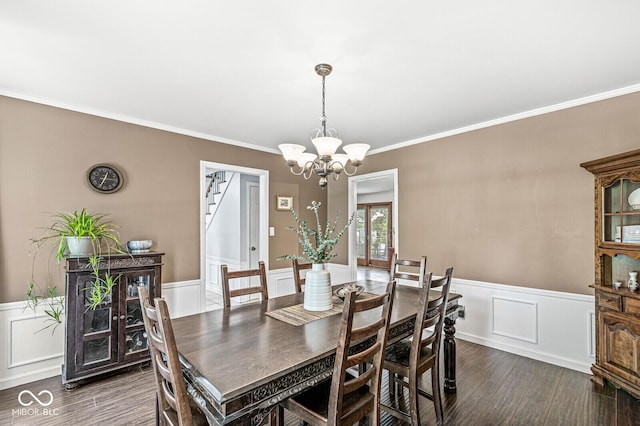 7138 Avalon Trail Ct, Indianapolis, IN 46250 - dining area with wood finished floors, ornamental molding, a chandelier, a wainscoted wall, and a decorative wall