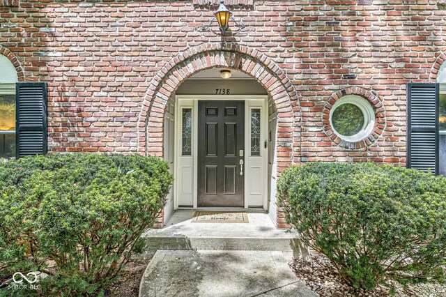 7138 Avalon Trail Ct, Indianapolis, IN 46250 - view of exterior entry with brick siding
