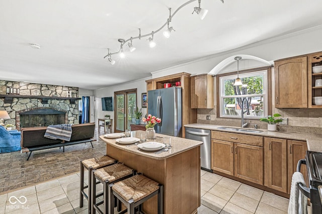 7138 Avalon Trail Ct, Indianapolis, IN 46250 - kitchen featuring appliances with stainless steel finishes, light tile patterned floors, open shelves, brown cabinetry, and ornamental molding