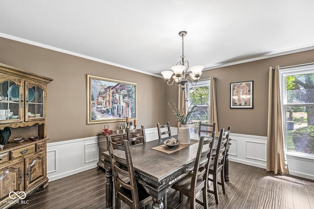 7138 Avalon Trail Ct, Indianapolis, IN 46250 - dining room featuring a decorative wall, a chandelier, dark wood finished floors, crown molding, and wainscoting
