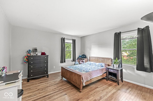 7138 Avalon Trail Ct, Indianapolis, IN 46250 - bedroom with light wood-type flooring and baseboards