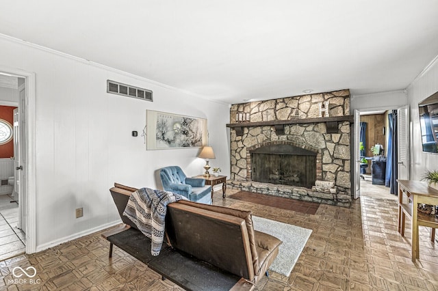 7138 Avalon Trail Ct, Indianapolis, IN 46250 - living room featuring ornamental molding and a stone fireplace