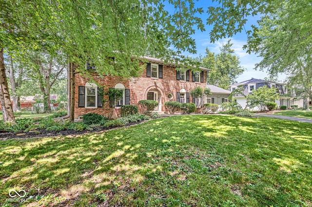 7138 Avalon Trail Ct, Indianapolis, IN 46250 - colonial house featuring a front yard, brick siding, and driveway