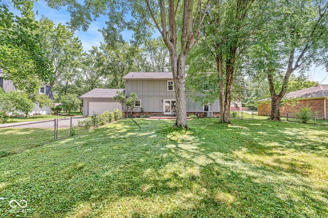 7138 Avalon Trail Ct, Indianapolis, IN 46250 - fenced backyard with concrete driveway and a garage