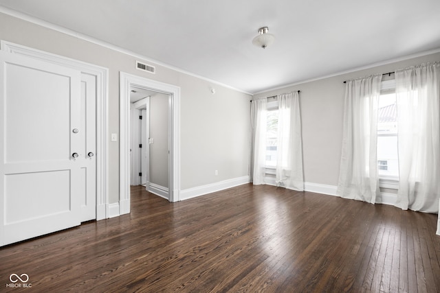 3447 Washington Blvd, Indianapolis, IN 46205 - spare room featuring dark wood-type flooring, crown molding, and baseboards
