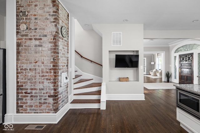 3447 Washington Blvd, Indianapolis, IN 46205 - staircase with wood finished floors and baseboards