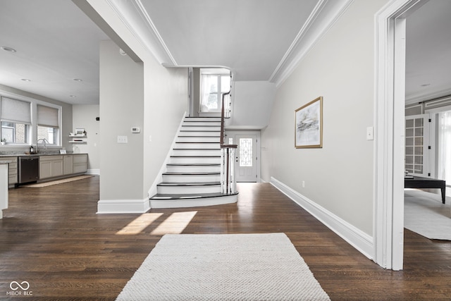 3447 Washington Blvd, Indianapolis, IN 46205 - stairs with ornamental molding, baseboards, and wood finished floors