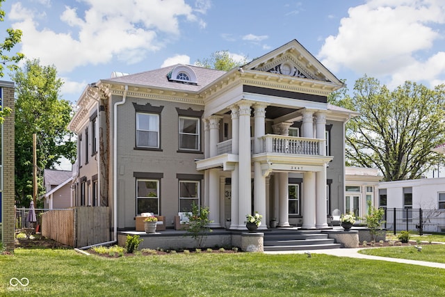 3447 Washington Blvd, Indianapolis, IN 46205 - greek revival inspired property with a balcony, brick siding, and covered porch