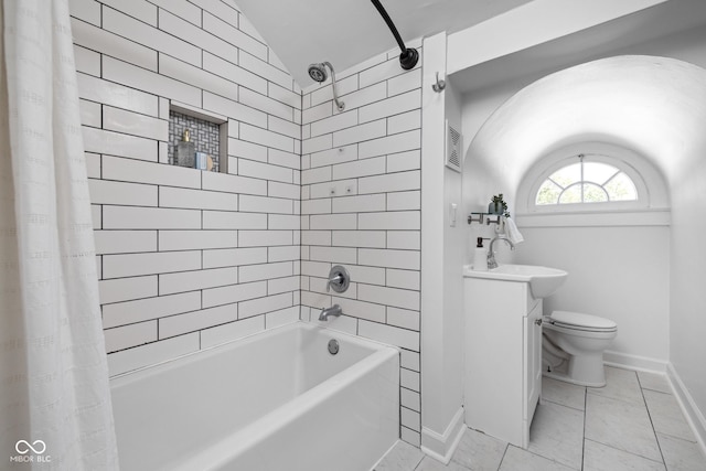 3447 Washington Blvd, Indianapolis, IN 46205 - full bath featuring baseboards, lofted ceiling, shower / tub combo, toilet, and vanity