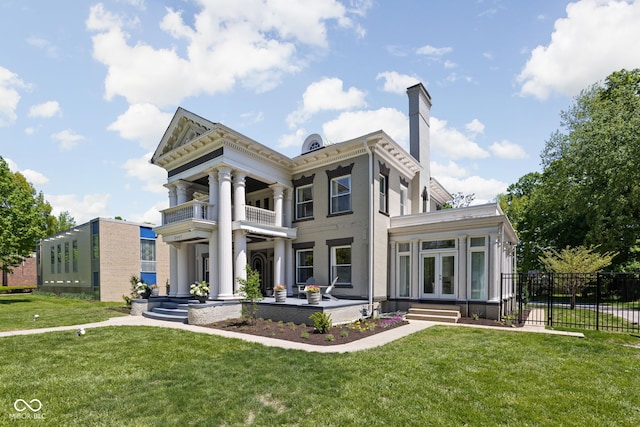 3447 Washington Blvd, Indianapolis, IN 46205 - view of front facade with french doors, a chimney, and a balcony