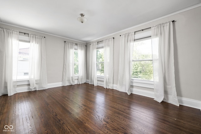 3447 Washington Blvd, Indianapolis, IN 46205 - empty room featuring wood finished floors, baseboards, and crown molding