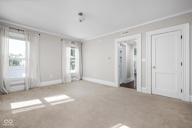 3447 Washington Blvd, Indianapolis, IN 46205 - unfurnished bedroom featuring carpet floors, baseboards, and crown molding