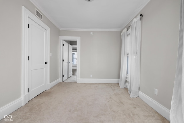 3447 Washington Blvd, Indianapolis, IN 46205 - unfurnished bedroom with carpet flooring, ornamental molding, and baseboards
