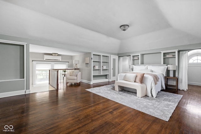 3447 Washington Blvd, Indianapolis, IN 46205 - bedroom featuring wood finished floors, a wall unit AC, and vaulted ceiling