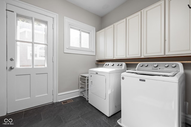 3447 Washington Blvd, Indianapolis, IN 46205 - laundry room featuring independent washer and dryer, cabinet space, and baseboards