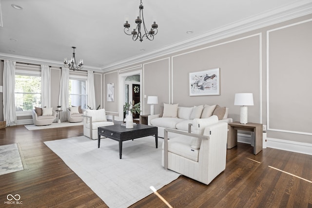 3447 Washington Blvd, Indianapolis, IN 46205 - living room featuring a chandelier, ornamental molding, and dark wood-style flooring