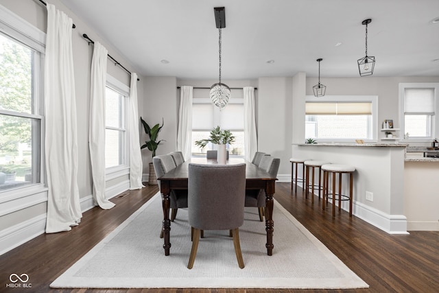3447 Washington Blvd, Indianapolis, IN 46205 - dining area featuring dark wood-style flooring, baseboards, and recessed lighting