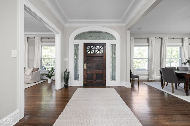 3447 Washington Blvd, Indianapolis, IN 46205 - entrance foyer with dark wood-style flooring, crown molding, and baseboards