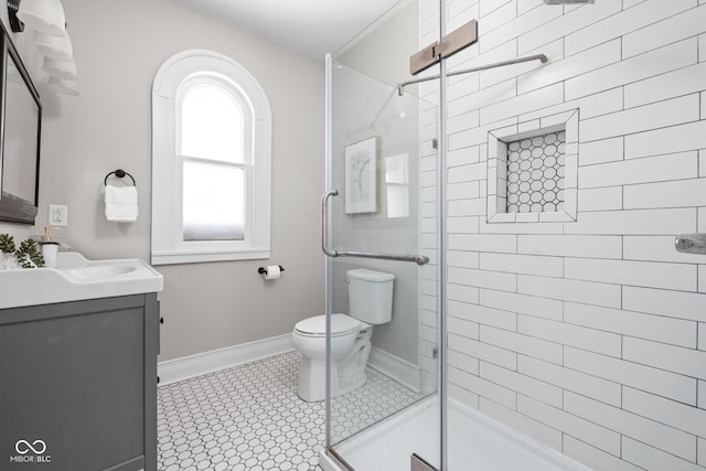 3447 Washington Blvd, Indianapolis, IN 46205 - full bath with vanity, a shower stall, toilet, and baseboards