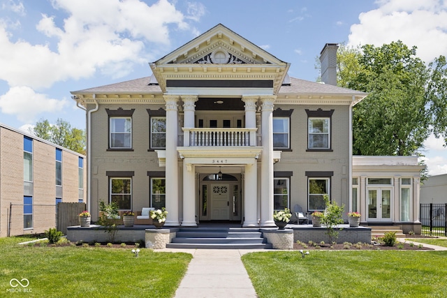 3447 Washington Blvd, Indianapolis, IN 46205 - view of front of house featuring french doors, a balcony, brick siding, and a chimney