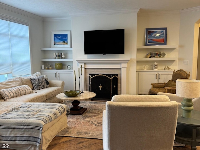 2460 Collins Dr, Westfield, IN 46074 - living area featuring wood finished floors, built in features, a fireplace, and crown molding