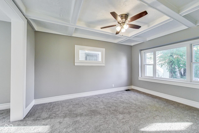 carpeted empty room with coffered ceiling, baseboards, and ceiling fan