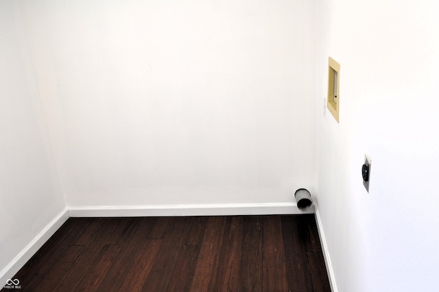 interior space with dark wood-style flooring and baseboards