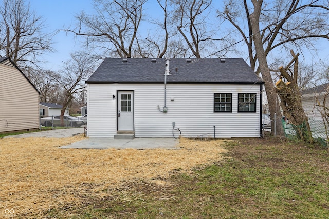 3105 N Tacoma Ave, Indianapolis, IN 46218 - rear view of house featuring a patio and roof with shingles