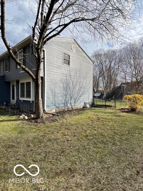 view of home's exterior featuring a lawn