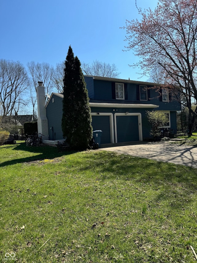 view of front of property with a garage, a front yard, driveway, and a chimney