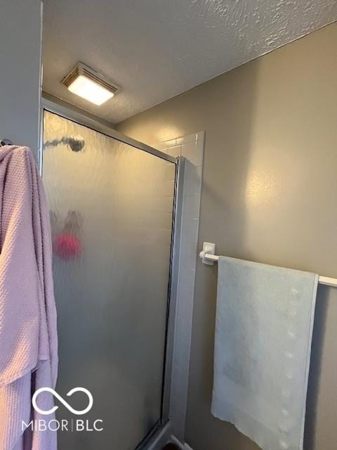 bathroom featuring a stall shower