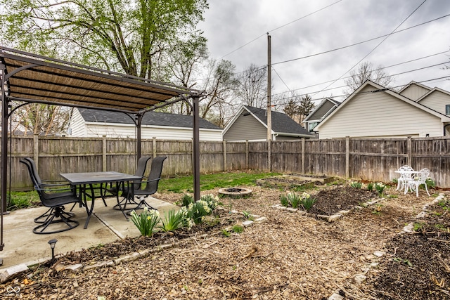 view of yard with a fire pit, fence, a pergola, and a patio area