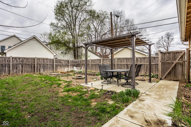 view of yard with a patio, a gate, a fenced backyard, and a pergola
