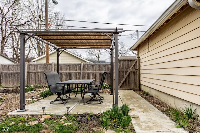 view of patio / terrace with a pergola, fence, and outdoor dining space