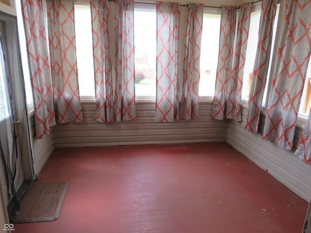 8358 Balmoral Dr, Avon, IN 46123 - empty room with healthy amount of natural light and wood walls