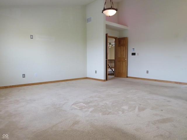 8358 Balmoral Dr, Avon, IN 46123 - carpeted empty room featuring baseboards and a towering ceiling
