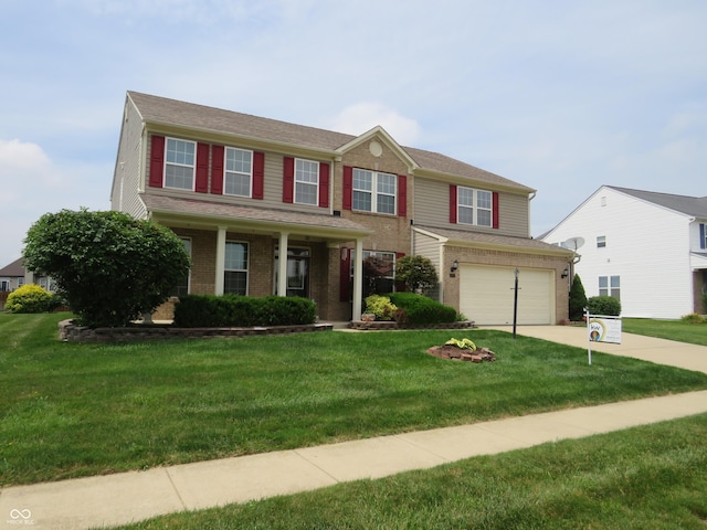 8358 Balmoral Dr, Avon, IN 46123 - view of front of house featuring an attached garage, concrete driveway, brick siding, and a front yard