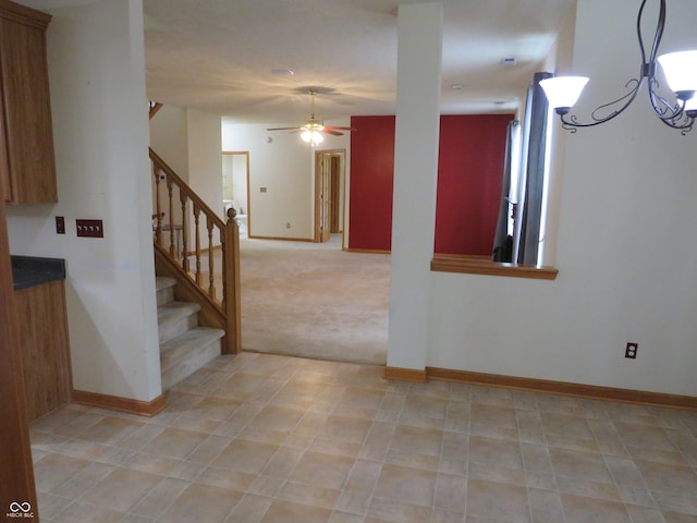 8358 Balmoral Dr, Avon, IN 46123 - basement with stairs, a ceiling fan, a chandelier, and light colored carpet