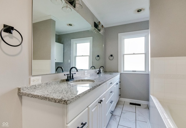 7525 N Meridian St, Indianapolis, IN 46260 - bathroom with ornamental molding, a sink, and a healthy amount of sunlight
