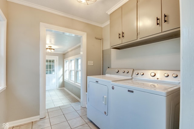 7525 N Meridian St, Indianapolis, IN 46260 - washroom featuring light tile patterned floors, cabinet space, washer and dryer, and crown molding