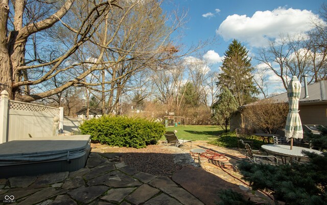 7525 N Meridian St, Indianapolis, IN 46260 - view of patio / terrace with a playground, fence, and a hot tub
