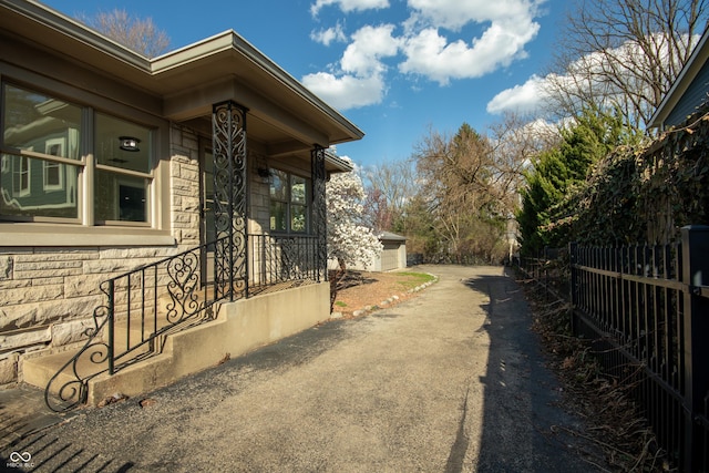 7525 N Meridian St, Indianapolis, IN 46260 - exterior space with stone siding and fence